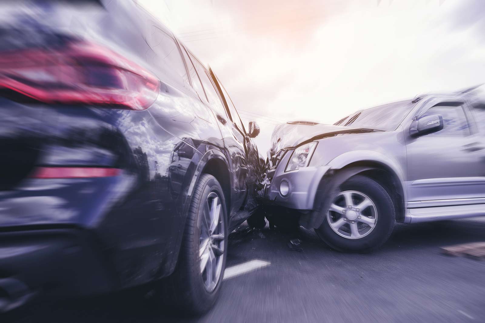 Car crash dangerous accident on the road. SUV car crashing beside another one on the road with speed zoom blur.