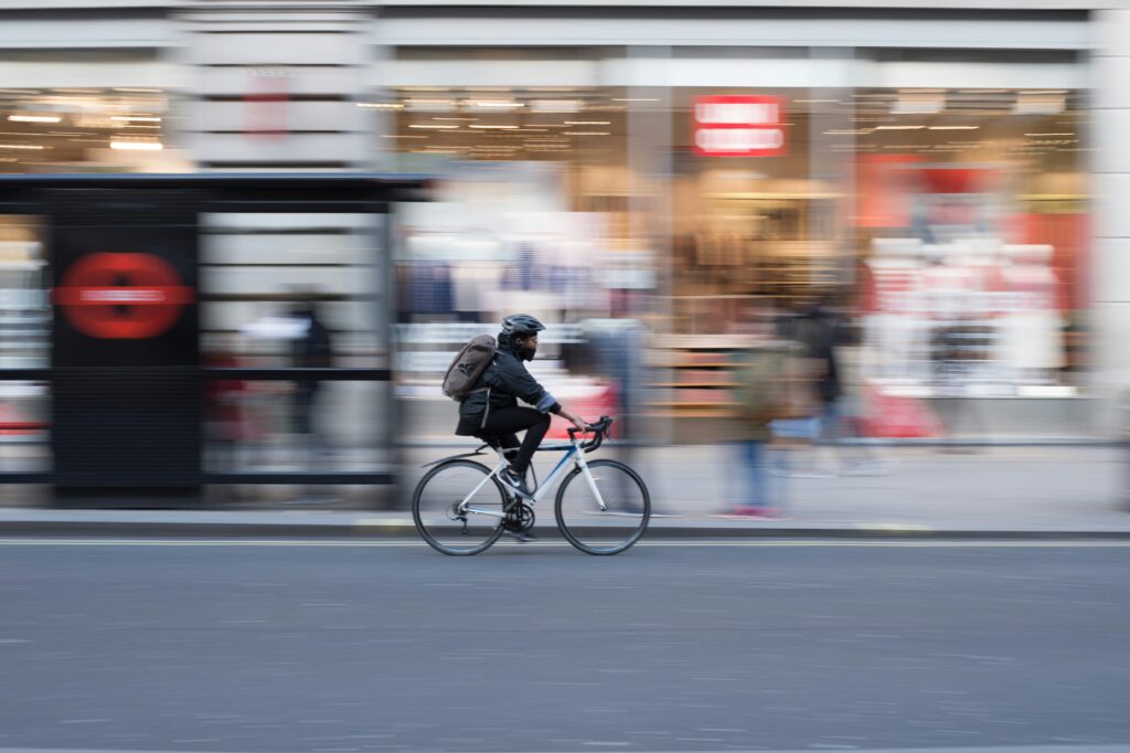 man riding his bicycle in the city